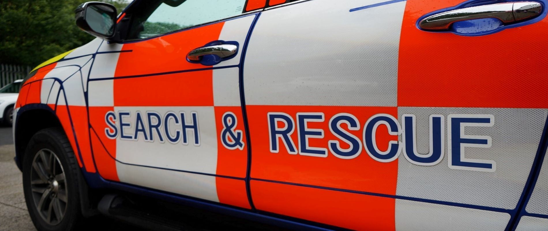 Bright orange and white, search and rescue vehicle.