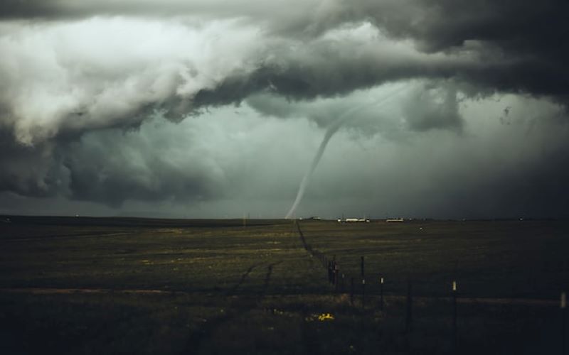 Tornado Alley - twister with cloud cover in distance.