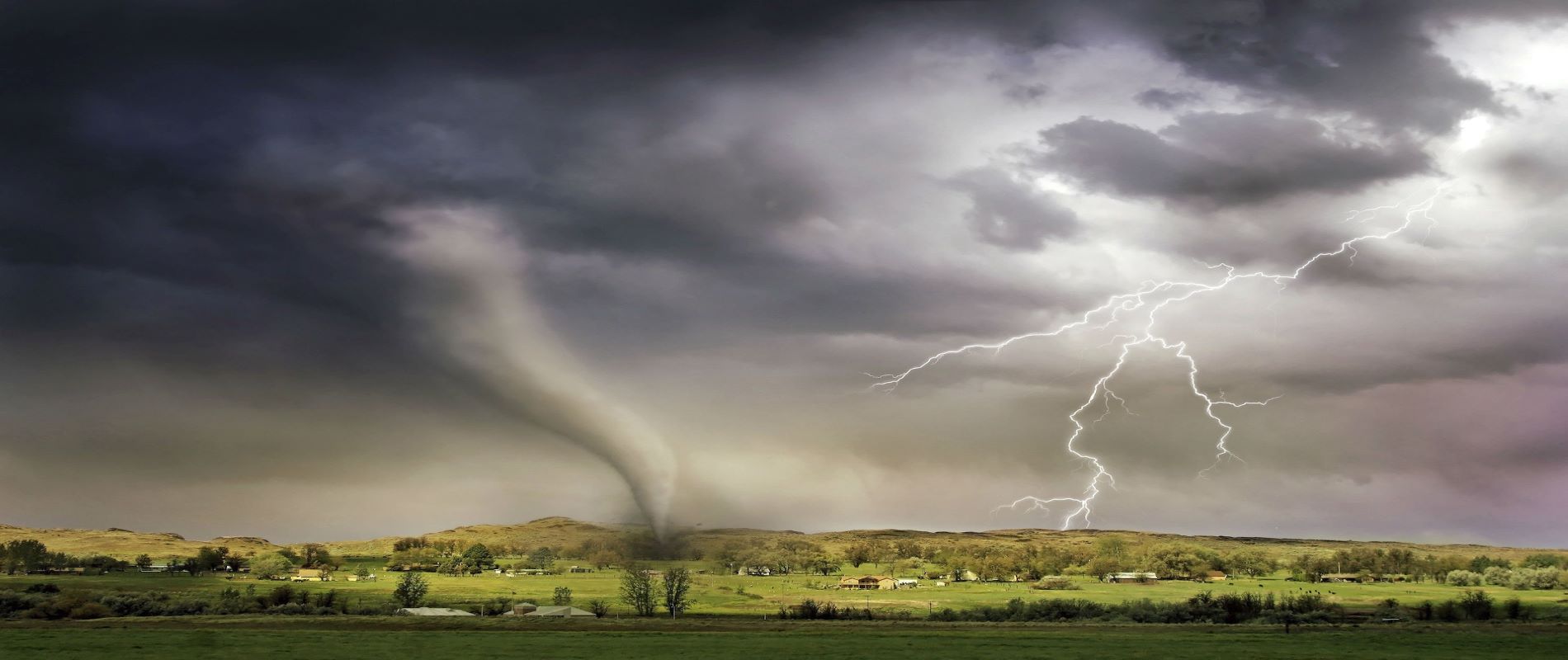 Natural disaster. Tornado twister and lightning strike town at the same moment.